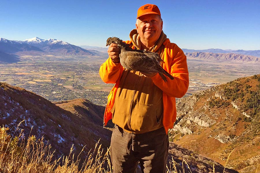 Scott holding a forest grouse