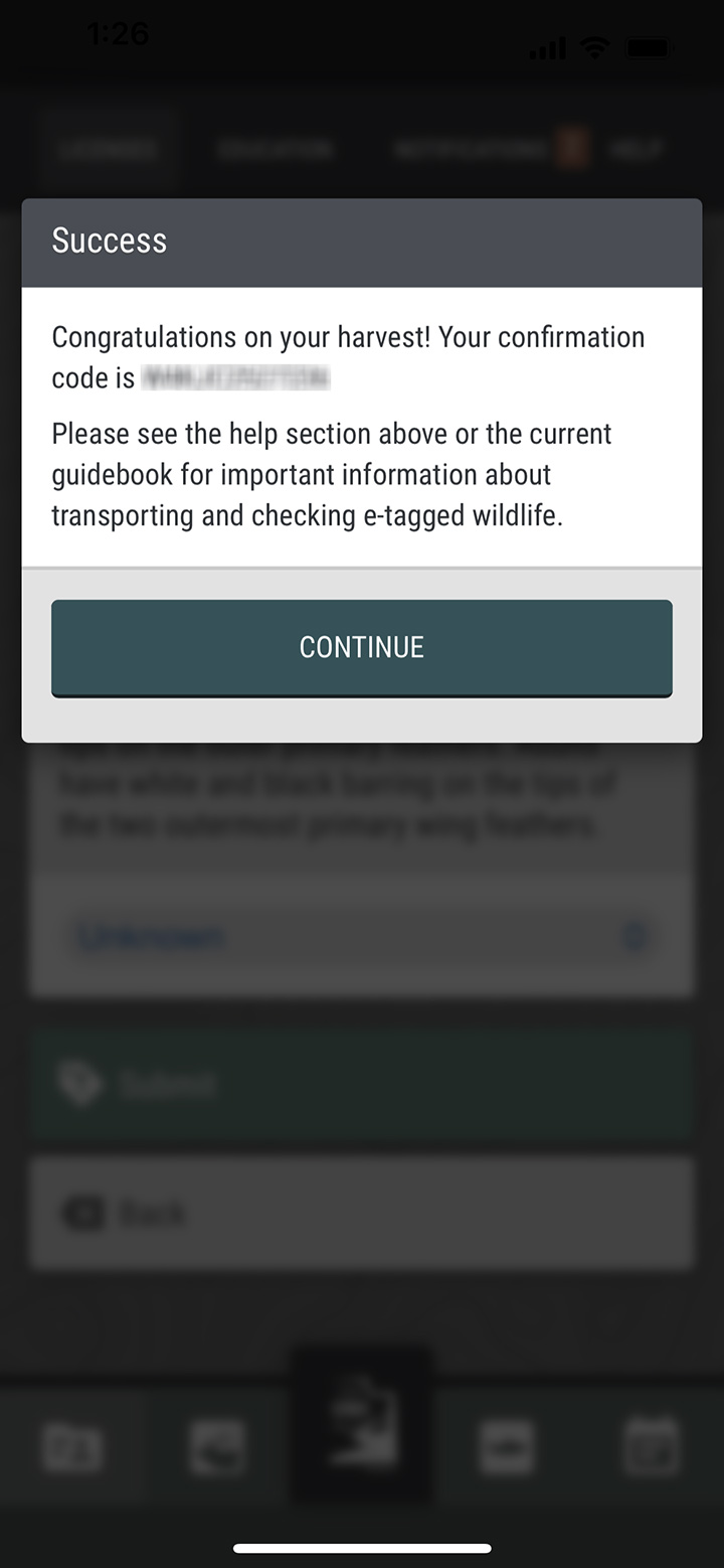 Screenshot of the iOS Utah Hunting & Fishing app showing the successful e-tag dialog box