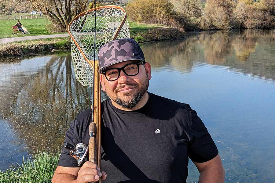 Joe Sanchez with fishing gear at a fishing pond