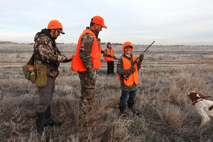 Hunters dressed in hunter orange, hunting on private land