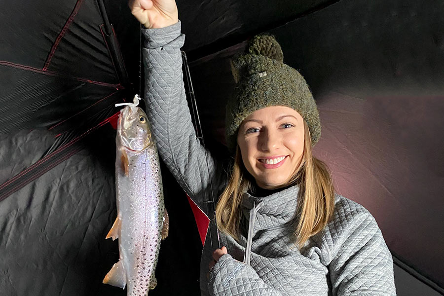 Female angler holding a caught Bear Lake cutthroat trout